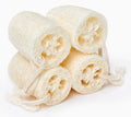 Four luffa sponges stacked neatly together
