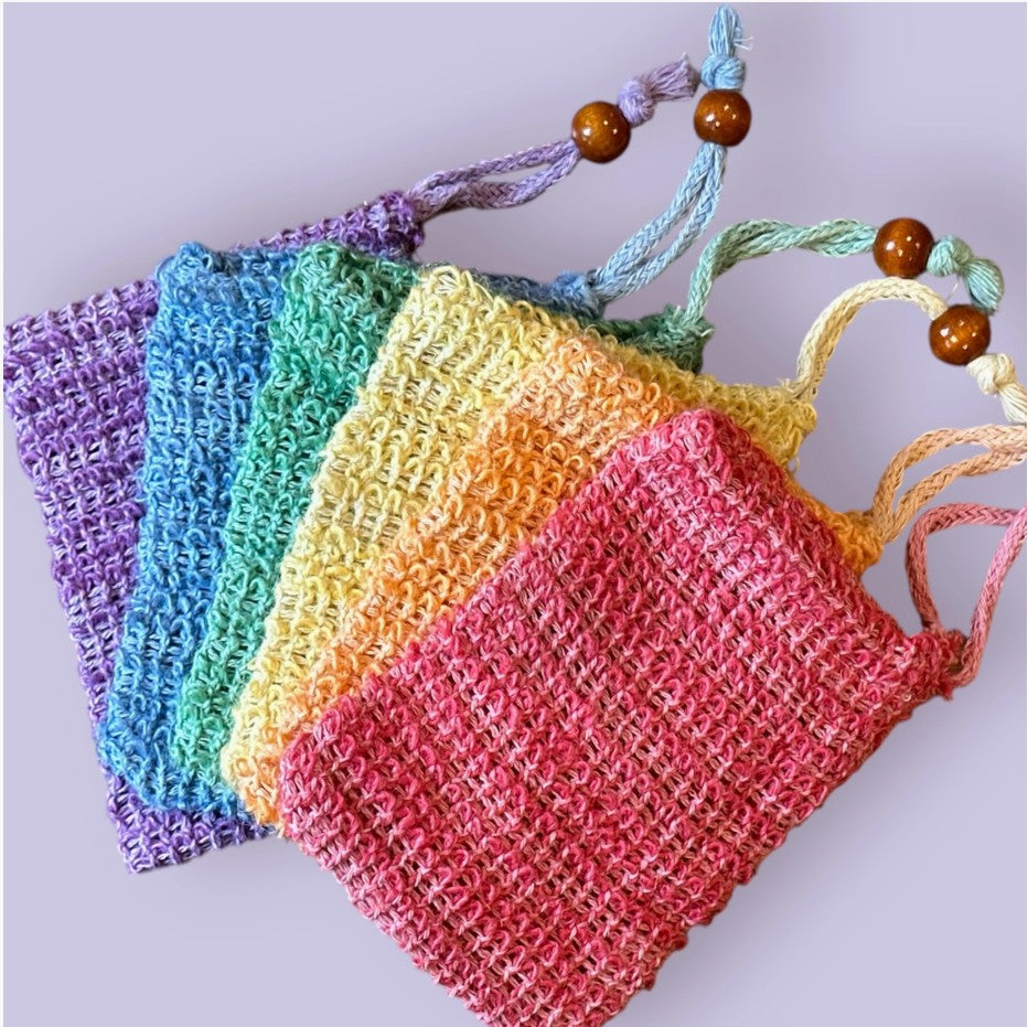 A collection of colorful sisal mesh bags displayed in a fan.