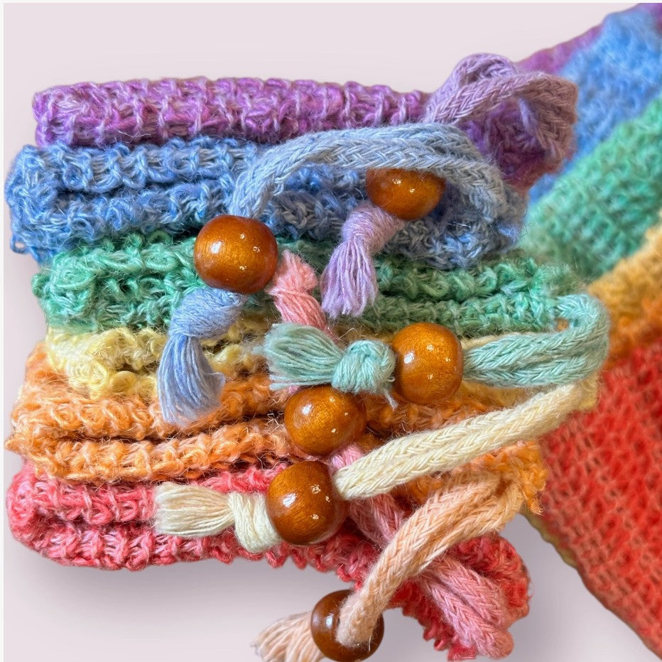 A collection of colorful woven fiber soap bags