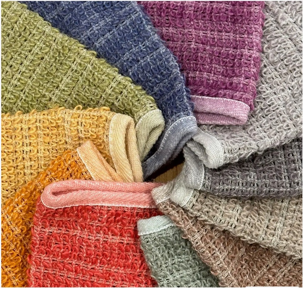 A collection of washcloths displayed in a circle.