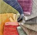 A collection of washcloths displayed in a circle.